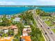 Aerial view of a house near a bridge over turquoise water, showcasing its prime location at 4001 5Th Ave, Holmes Beach, FL 34217
