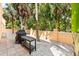 This backyard has a BBQ grill and an outdoor table for food preparation at 4001 5Th Ave, Holmes Beach, FL 34217