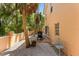 This backyard features a BBQ grill and outdoor seating in a private, landscaped space at 4001 5Th Ave, Holmes Beach, FL 34217