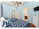 Bright bedroom showcasing twin beds, an en-suite bathroom, and coastal-themed decor at 4001 5Th Ave, Holmes Beach, FL 34217