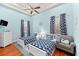 Charming bedroom with twin beds, nautical-themed decor, and hardwood floors for a cozy atmosphere at 4001 5Th Ave, Holmes Beach, FL 34217