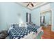 Inviting bedroom with twin beds, ship-themed decor, and a mirrored closet enhancing the space at 4001 5Th Ave, Holmes Beach, FL 34217