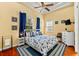 Bright bedroom featuring nautical-themed decor, hardwood floors, and natural light at 4001 5Th Ave, Holmes Beach, FL 34217