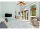 Bright bedroom with large windows, armchair, and decorative nautical touches for a relaxing coastal vibe at 4001 5Th Ave, Holmes Beach, FL 34217