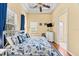 Bright bedroom with a nautical theme, featuring an en-suite bathroom at 4001 5Th Ave, Holmes Beach, FL 34217