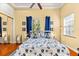 Comfortable bedroom with a nautical theme, featuring hardwood floors and natural light at 4001 5Th Ave, Holmes Beach, FL 34217