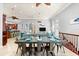 Bright dining area is perfect for entertaining, featuring stylish decor, tile flooring, and easy access to kitchen and living areas at 4001 5Th Ave, Holmes Beach, FL 34217
