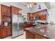 This kitchen boasts granite countertops, stainless appliances, and dark wood cabinets for a modern touch at 4001 5Th Ave, Holmes Beach, FL 34217