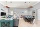 Open-concept living area with tile floors, ample natural light, and a cozy dining space at 4001 5Th Ave, Holmes Beach, FL 34217