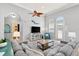 Coastal-style living room is designed for entertainment, and is adorned with neutral colors and plenty of natural light at 4001 5Th Ave, Holmes Beach, FL 34217