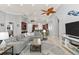 Inviting living room with coastal-themed accents offers ample seating and seamless connection to dining and kitchen spaces at 4001 5Th Ave, Holmes Beach, FL 34217