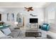 Living room featuring coastal-themed decor, a spacious layout, and seamless flow to the dining area, ideal for gatherings at 4001 5Th Ave, Holmes Beach, FL 34217