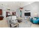 Spacious living room with coastal decor, features comfortable seating, a large TV, and easy access to the kitchen at 4001 5Th Ave, Holmes Beach, FL 34217
