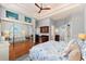 Spacious main bedroom features mirrored closet doors, tray ceiling, beverage bar and hardwood flooring at 4001 5Th Ave, Holmes Beach, FL 34217