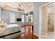 Spacious main bedroom features hardwood floors, recessed lighting, and access to the en-suite bathroom at 4001 5Th Ave, Holmes Beach, FL 34217