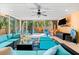 This gorgeous pool room has comfortable lounge seating and a wet bar with pass-through to the outdoor patio at 4001 5Th Ave, Holmes Beach, FL 34217