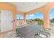 Spacious rooftop deck with an outdoor dining table, lounge chairs, and beautiful neighborhood views at 4001 5Th Ave, Holmes Beach, FL 34217