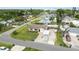 Aerial view of a home and the neighborhood with mature trees and boat parking at 4221 3Rd W Ave, Palmetto, FL 34221