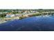 Scenic waterfront home featuring a private dock and serene views of the surrounding waterway and community at 4221 3Rd W Ave, Palmetto, FL 34221