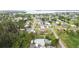 Aerial view of a charming neighborhood with lush greenery and easy access to the lake at 4221 3Rd W Ave, Palmetto, FL 34221