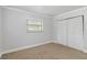 Neutral bedroom featuring a window and closet at 4221 3Rd W Ave, Palmetto, FL 34221
