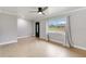 Spacious living room featuring neutral walls, tile flooring, and a large window for ample natural light at 4221 3Rd W Ave, Palmetto, FL 34221