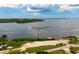 Scenic view of the waterfront, featuring a boat launch, grassy areas, and ample parking at 4221 3Rd W Ave, Palmetto, FL 34221