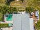 Bird's eye view of backyard featuring pool, spa, deck, and mature landscaping with palm trees at 424 62Nd St, Holmes Beach, FL 34217