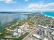 Coastal aerial showcases town's unique peninsula location, with marina access, community services, and waterfront homes at 424 62Nd St, Holmes Beach, FL 34217