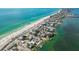 An aerial view showcasing the beach, coastline, residential area and intercoastal waterway at 424 62Nd St, Holmes Beach, FL 34217