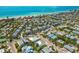 Sweeping aerial view of a coastal town's homes, with easy access to the beach and vibrant community at 424 62Nd St, Holmes Beach, FL 34217