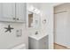 Bathroom showcasing a modern vanity, mirror, and fixtures with a minimalist design at 424 62Nd St, Holmes Beach, FL 34217