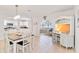 Dining room with table and view of kitchen, sunroom, and built-in hutch at 424 62Nd St, Holmes Beach, FL 34217