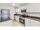 Modern kitchen featuring stainless steel appliances, stylish cabinetry, and durable countertops at 424 62Nd St, Holmes Beach, FL 34217