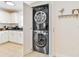 Convenient laundry closet with stacked washer and dryer located in the kitchen area at 424 62Nd St, Holmes Beach, FL 34217