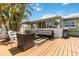 Relaxing outdoor patio featuring cushioned seating, grill and a spacious deck ideal for entertaining in a private backyard at 424 62Nd St, Holmes Beach, FL 34217