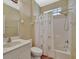 Bathroom includes a vanity with sink, toilet, and a shower-tub combination with a curtain at 4344 Nizza Ct, Venice, FL 34293