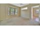 Spacious bedroom boasting a ceiling fan, large windows, and backyard views at 4344 Nizza Ct, Venice, FL 34293