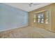 Inviting bedroom featuring a bay window with backyard views and a ceiling fan at 4344 Nizza Ct, Venice, FL 34293