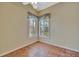 Cozy bedroom featuring light walls, tile floors, shuttered windows and natural light, perfect for relaxation at 4344 Nizza Ct, Venice, FL 34293