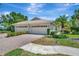Charming single Gathering home featuring a two-car garage, well manicured yard, and a tile roof at 4344 Nizza Ct, Venice, FL 34293