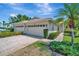 Beautiful single Gathering home boasting an attached two-car garage, paver driveway and tiled roof at 4344 Nizza Ct, Venice, FL 34293
