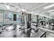 Community gym with exercise machines, floor to ceiling mirrors and a view of the pool outside at 4344 Nizza Ct, Venice, FL 34293