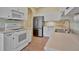 Contemporary kitchen featuring white cabinets, stainless steel appliances, and tile floors for a modern look at 4344 Nizza Ct, Venice, FL 34293