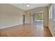 Expansive living space with tile flooring, plantation shutters, and sliding glass doors to lanai at 4344 Nizza Ct, Venice, FL 34293