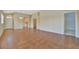 Open-concept living room features neutral walls and tile flooring, flooded with plenty of natural light at 4344 Nizza Ct, Venice, FL 34293