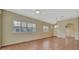 Spacious living area with tile flooring, plantation shutters, and a neutral color scheme at 4344 Nizza Ct, Venice, FL 34293