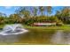 Community water fountain surrounded by lush landscaping and the neighborhood name at 4344 Nizza Ct, Venice, FL 34293