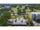 Aerial view of condominium complex featuring pool and clubhouse at 4440 Fairways Blvd # 210, Bradenton, FL 34209