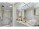 Clean bathroom with glass-enclosed shower, vanity, and ample storage space at 4440 Fairways Blvd # 210, Bradenton, FL 34209